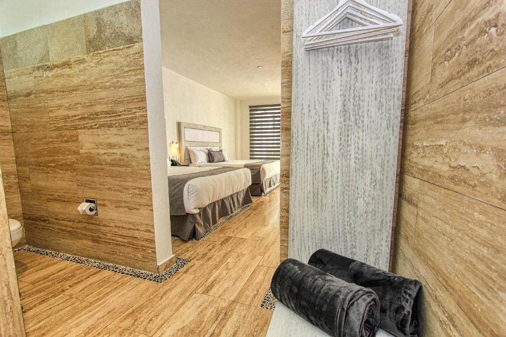 Postel nebo postele na pokoji v ubytování Hotel Splash Inn