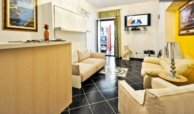 TV a/nebo společenská místnost v ubytování Affittacamere Sardegna Sole e Mare