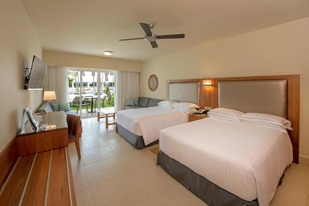 Postel nebo postele na pokoji v ubytování Occidental Punta Cana - All Inclusive