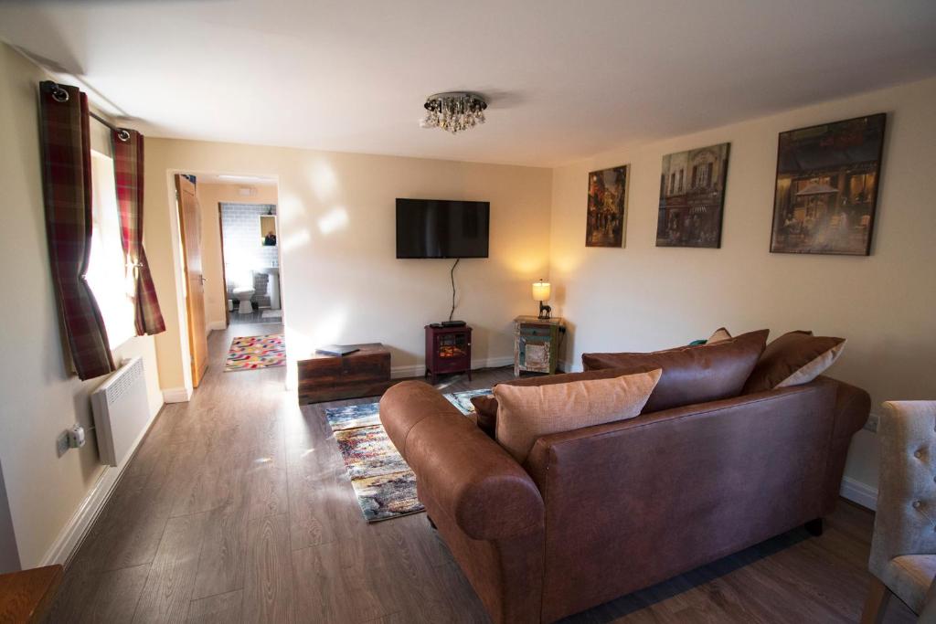 TV a/nebo společenská místnost v ubytování West Mead Cottage