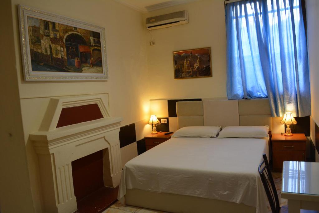 Postel nebo postele na pokoji v ubytování Hotel Republika