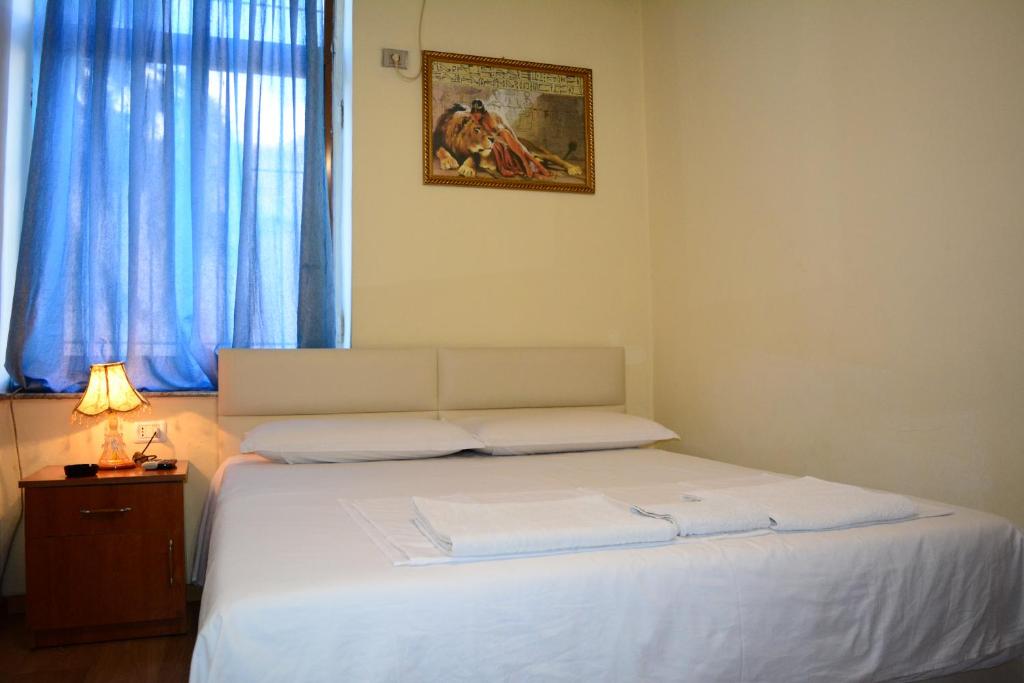 Postel nebo postele na pokoji v ubytování Hotel Republika