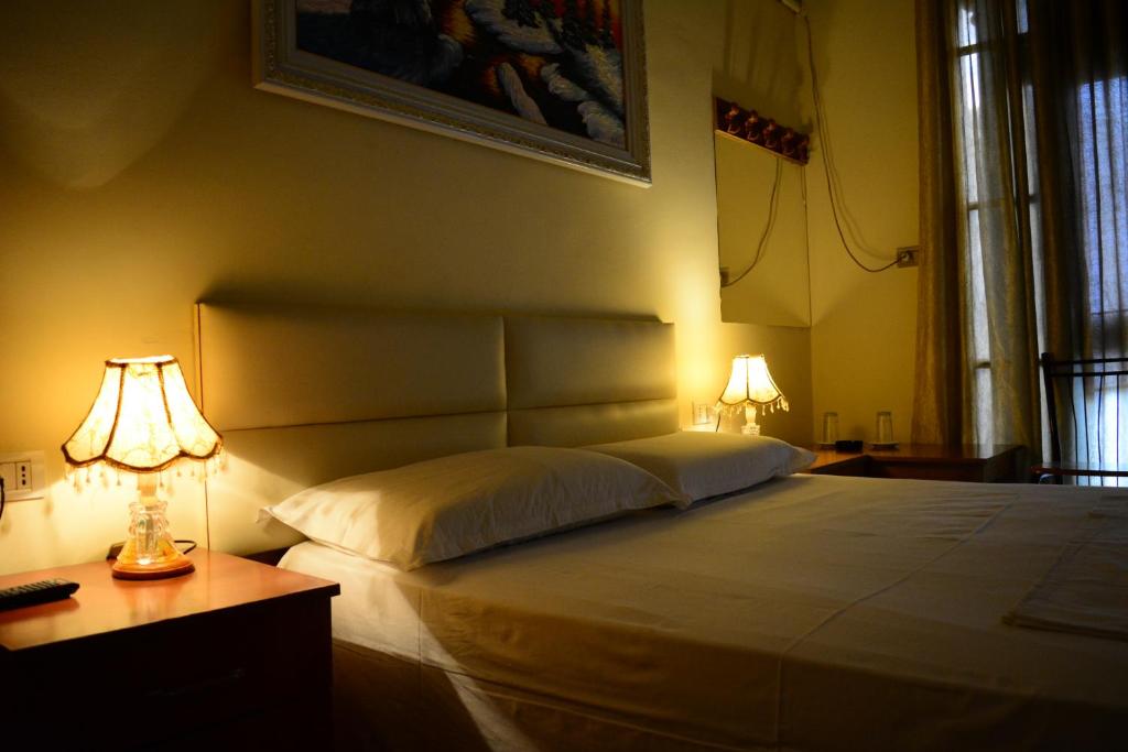 Postel nebo postele na pokoji v ubytování Hotel Republika
