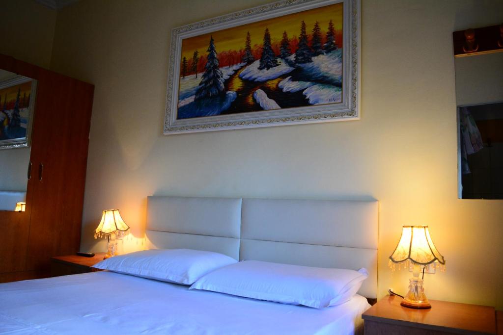 Postel nebo postele na pokoji v ubytování Hotel Republika