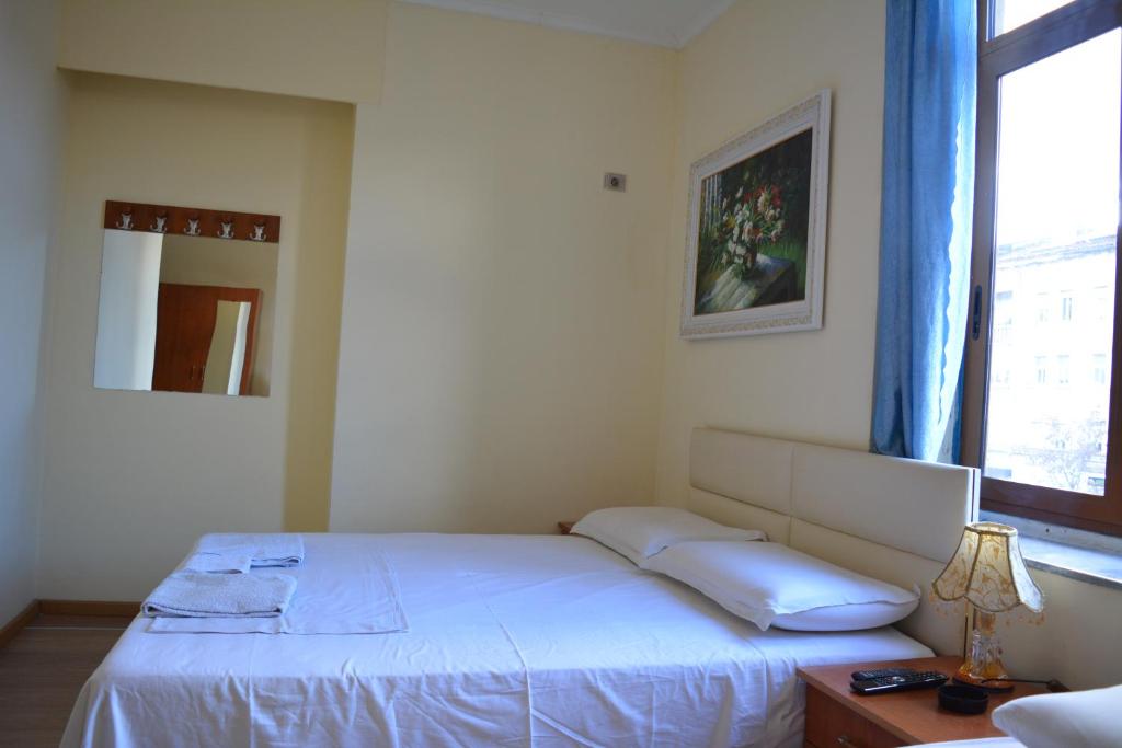 Postel nebo postele na pokoji v ubytování Hotel Republika