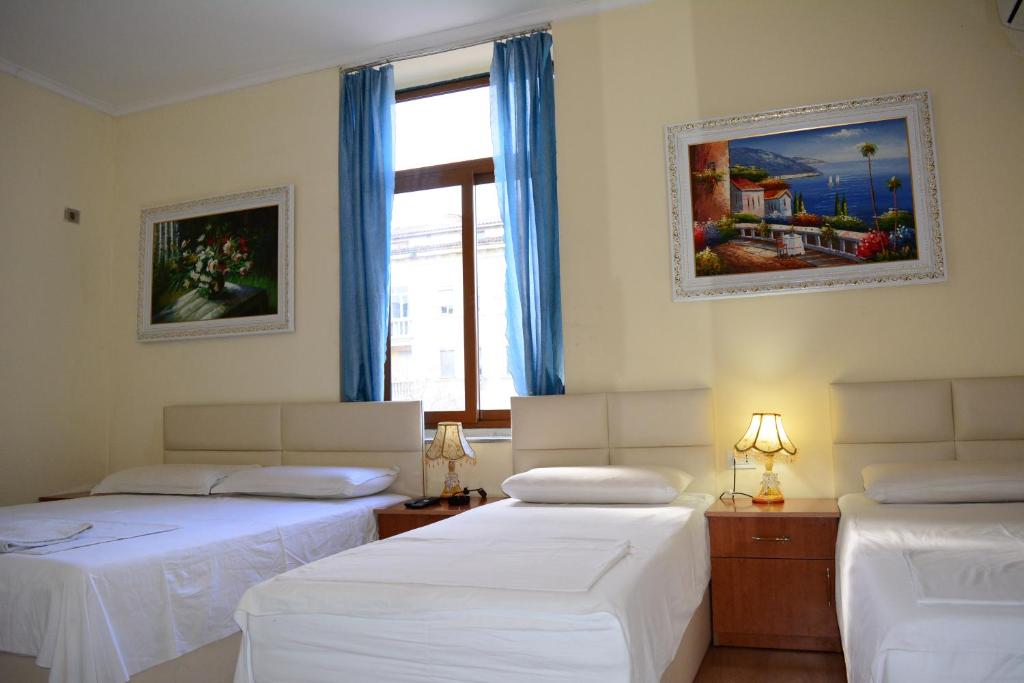 Postel nebo postele na pokoji v ubytování Hotel Republika