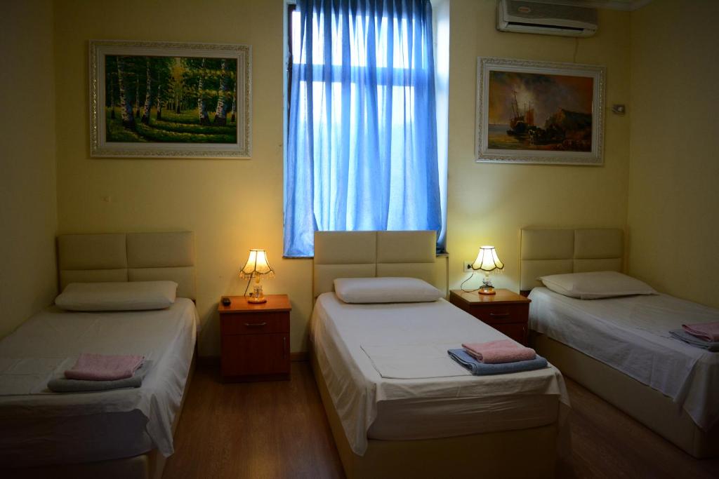 Postel nebo postele na pokoji v ubytování Hotel Republika