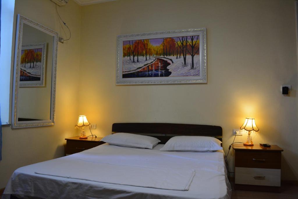 Postel nebo postele na pokoji v ubytování Hotel Republika