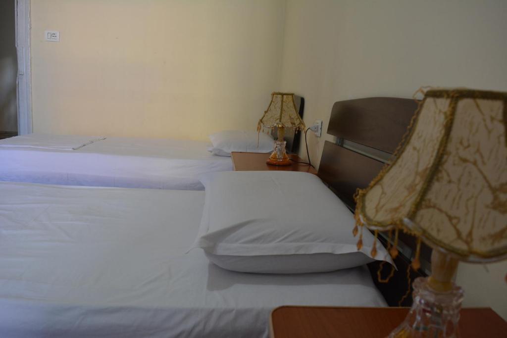 Postel nebo postele na pokoji v ubytování Hotel Republika