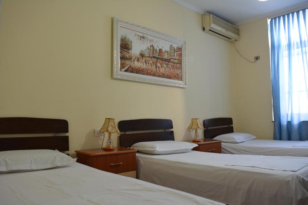 Postel nebo postele na pokoji v ubytování Hotel Republika