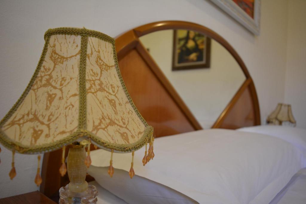 Postel nebo postele na pokoji v ubytování Hotel Republika