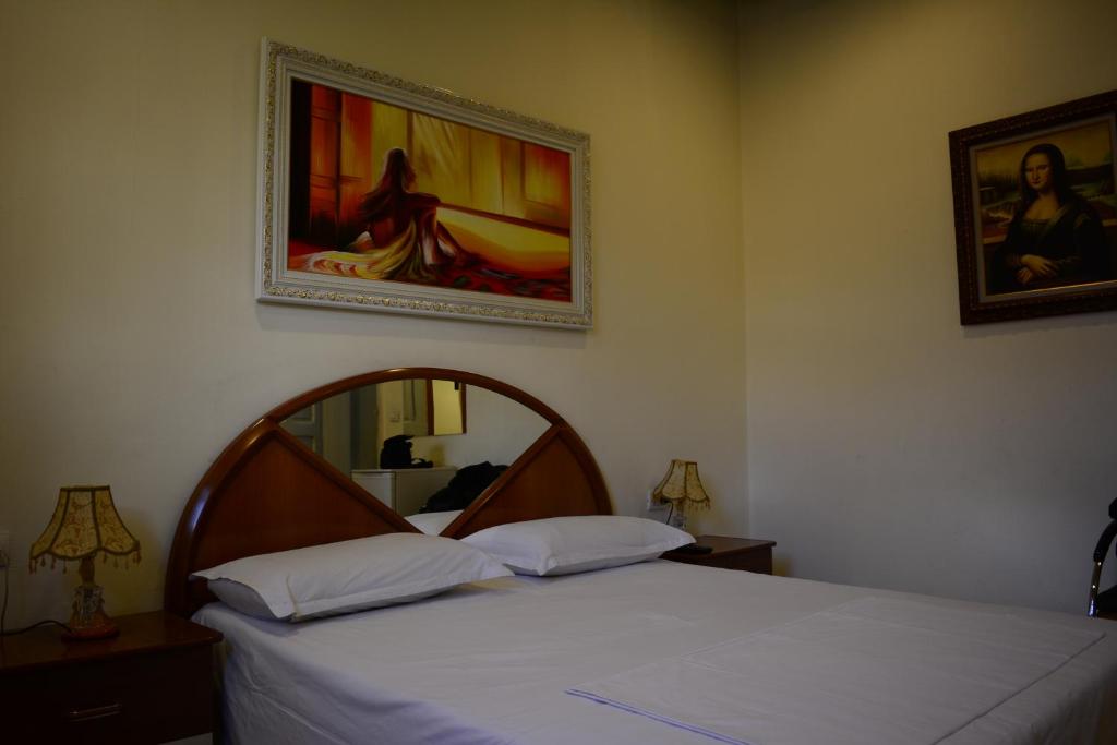 Postel nebo postele na pokoji v ubytování Hotel Republika