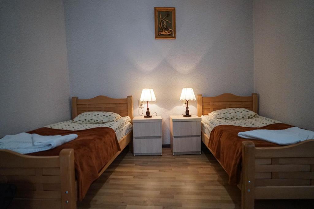 Postel nebo postele na pokoji v ubytování Family Hotel Mountain Scream