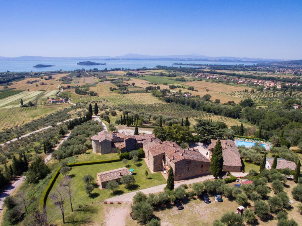 an aerial view of an estate with a large house at Relais Borgo Torale in Passignano sul Trasimeno