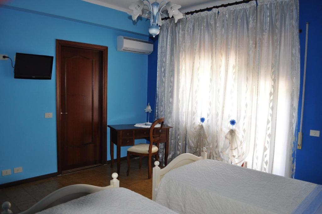 Postel nebo postele na pokoji v ubytování L' Aia Antica