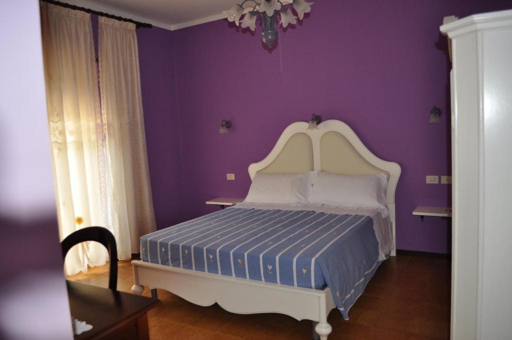 Postel nebo postele na pokoji v ubytování L' Aia Antica
