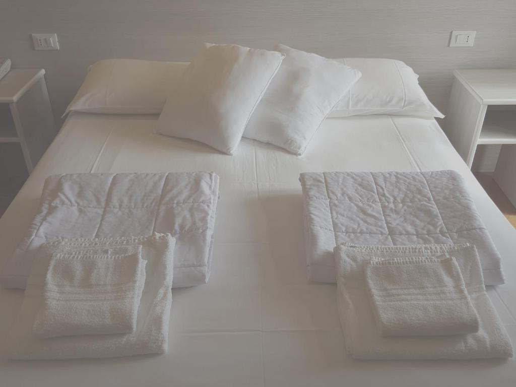 Postel nebo postele na pokoji v ubytování Hotel Righetto Fronte Mare