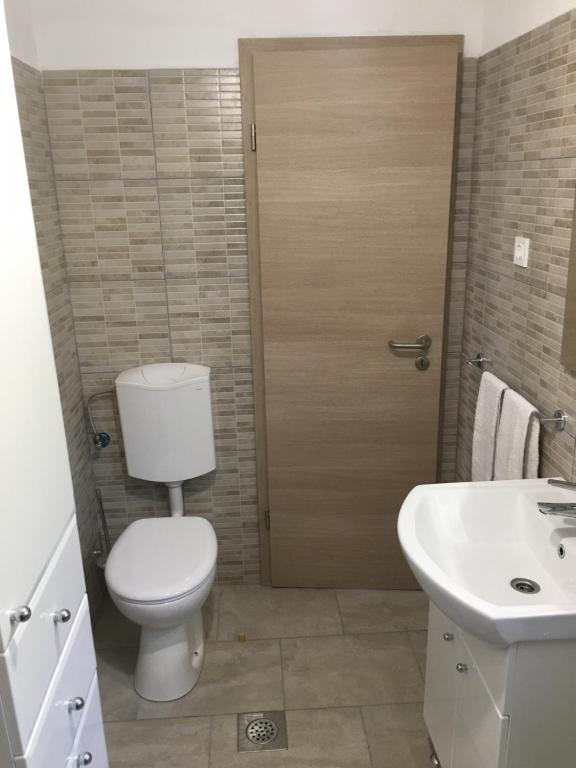 Kúpeľňa v ubytovaní Apartments Kurelja