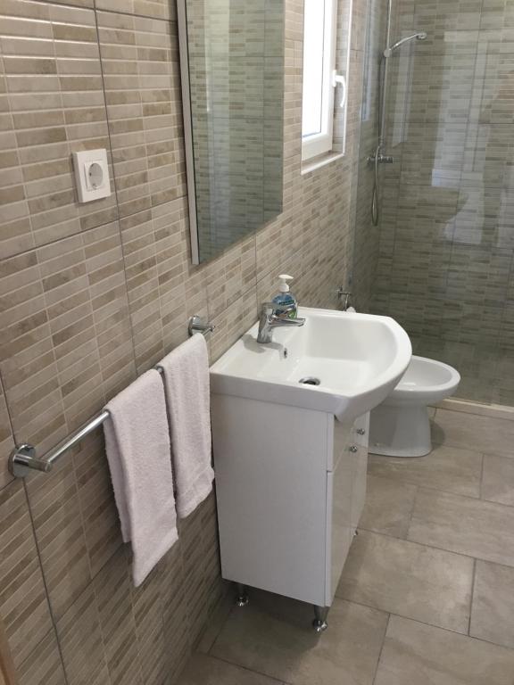 Kúpeľňa v ubytovaní Apartments Kurelja