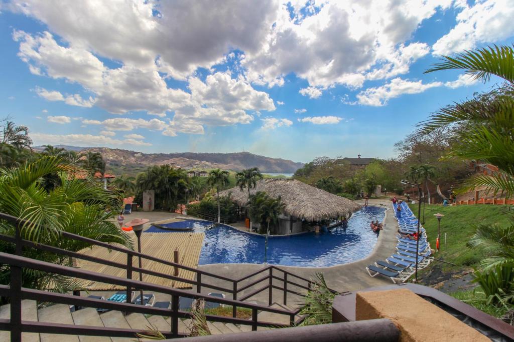 a lazy river at a resort with a water park at Villas @ Villa Sol in Guanacaste