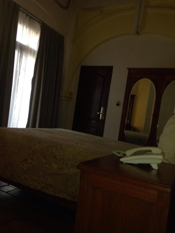 Postel nebo postele na pokoji v ubytování Hotel Meson del Mar