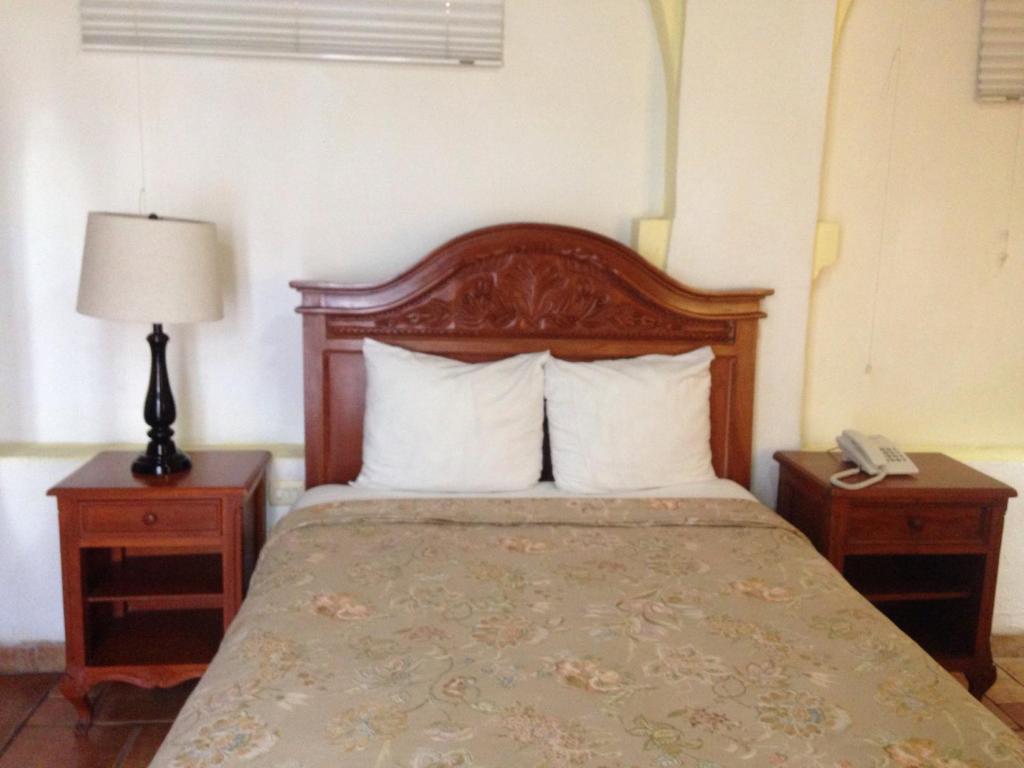 Postel nebo postele na pokoji v ubytování Hotel Meson del Mar