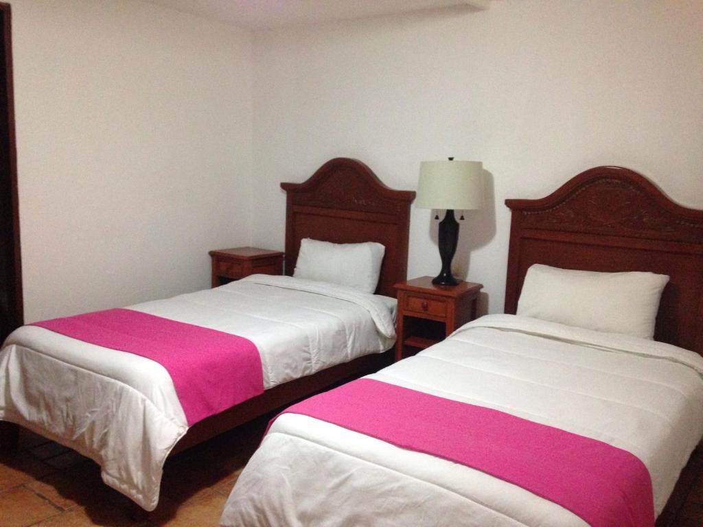 Postel nebo postele na pokoji v ubytování Hotel Meson del Mar