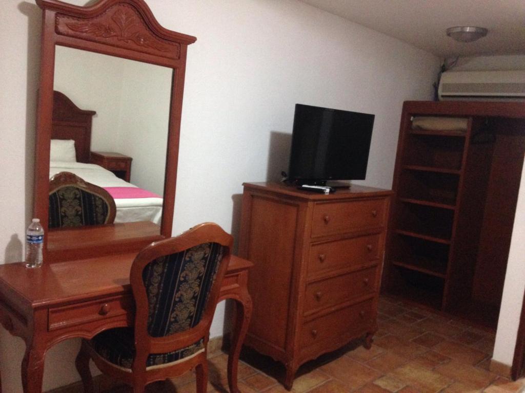 TV a/nebo společenská místnost v ubytování Hotel Meson del Mar