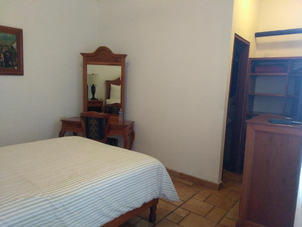 Postel nebo postele na pokoji v ubytování Hotel Meson del Mar