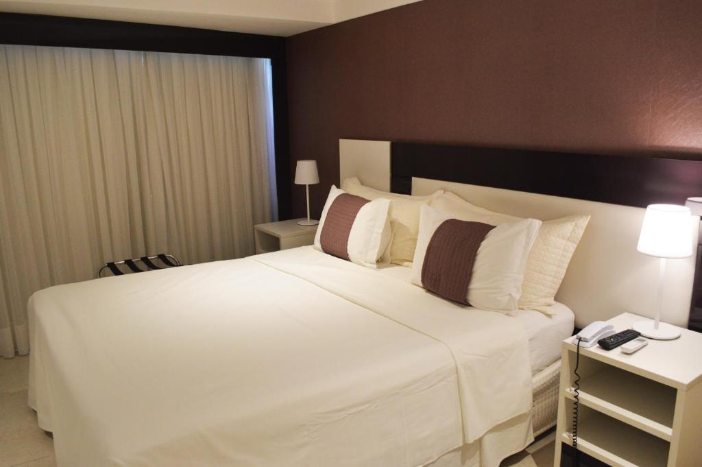 Cama ou camas em um quarto em Nord Luxxor Sapucaia