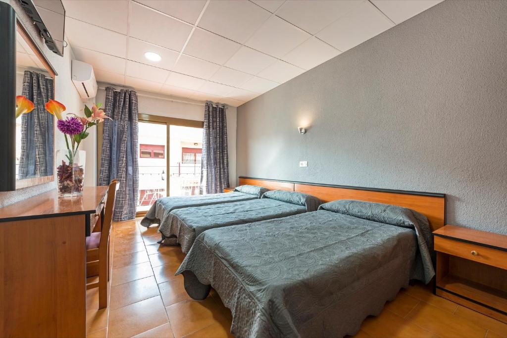 Postel nebo postele na pokoji v ubytování Hotel Mar i Sol