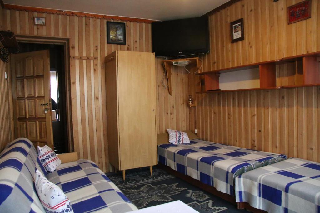 Posteľ alebo postele v izbe v ubytovaní Noclegi Bukowina Centrum