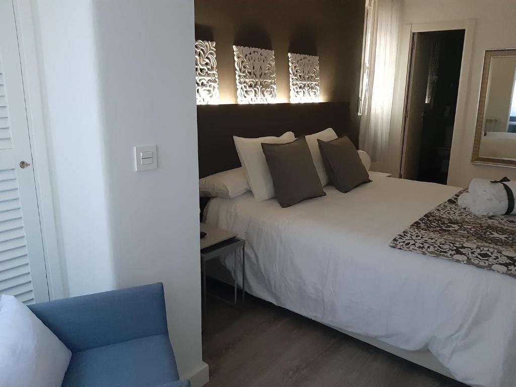A bed or beds in a room at La parada de Conde Aranda