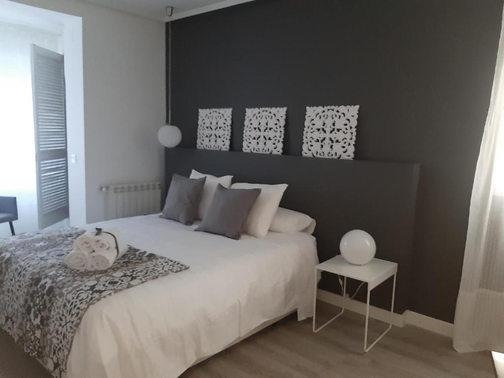 A bed or beds in a room at La parada de Conde Aranda