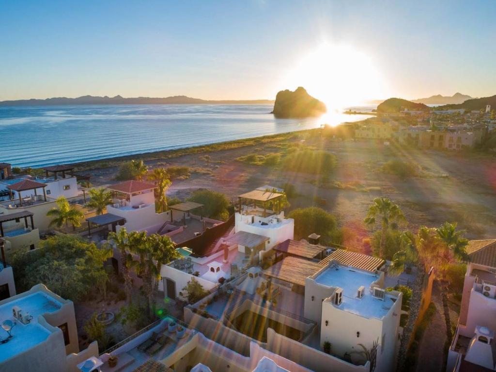 an aerial view of a beach with white houses and the ocean at Casa Vista del Mar in Loreto