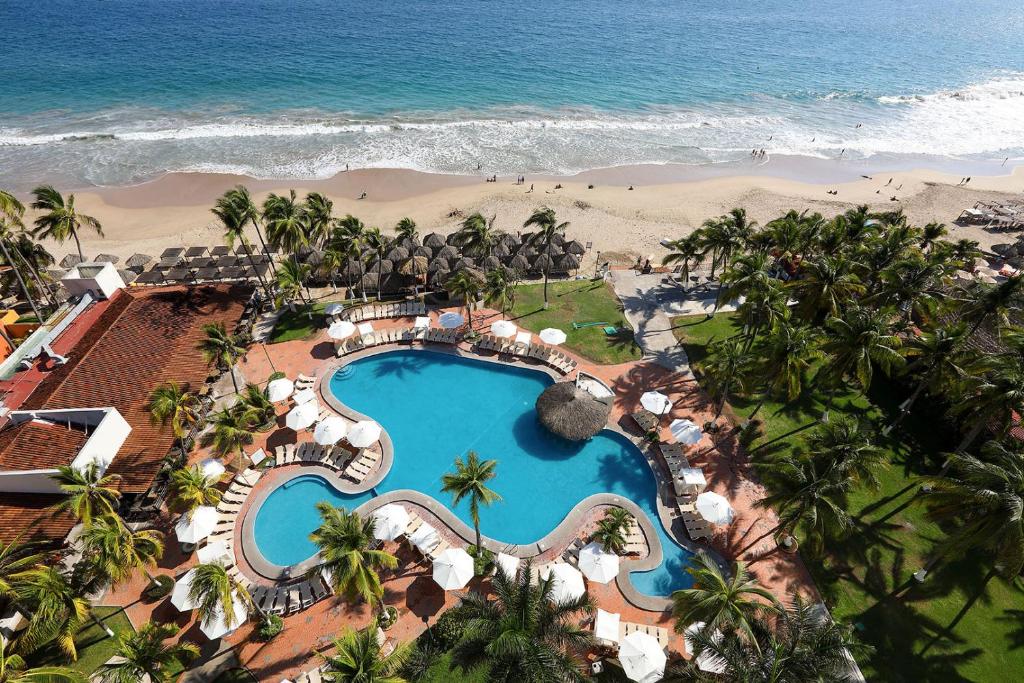 an aerial view of a resort with a swimming pool and the beach at Emporio Ixtapa - with Optional All Inclusive in Ixtapa