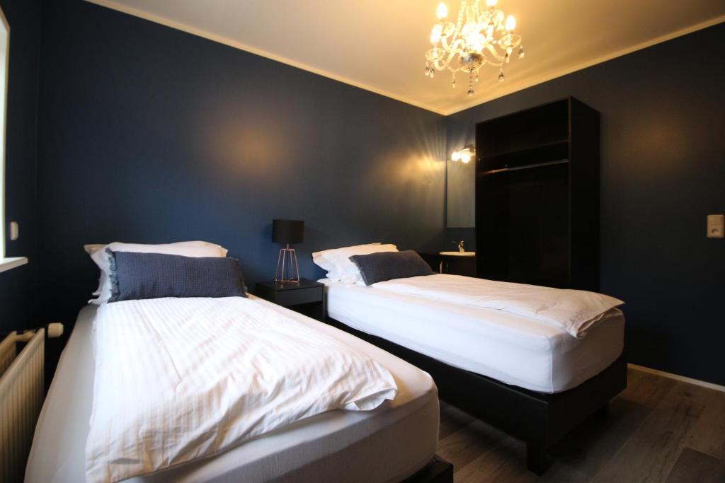 Rúm í herbergi á Hotel North
