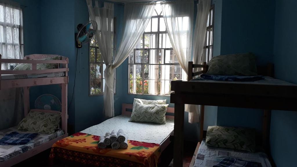 Postel nebo postele na pokoji v ubytování cv bed n bath san juan