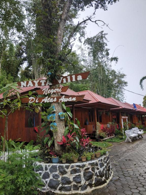 a market building with a sign in front of it at Nayta villa Lolai toraja in Rantepao