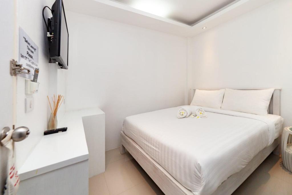 Postel nebo postele na pokoji v ubytování Baanpoon Apartment