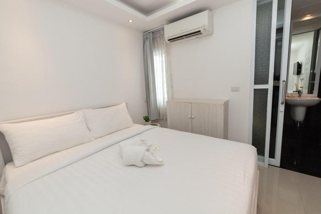 Postel nebo postele na pokoji v ubytování Baanpoon Apartment