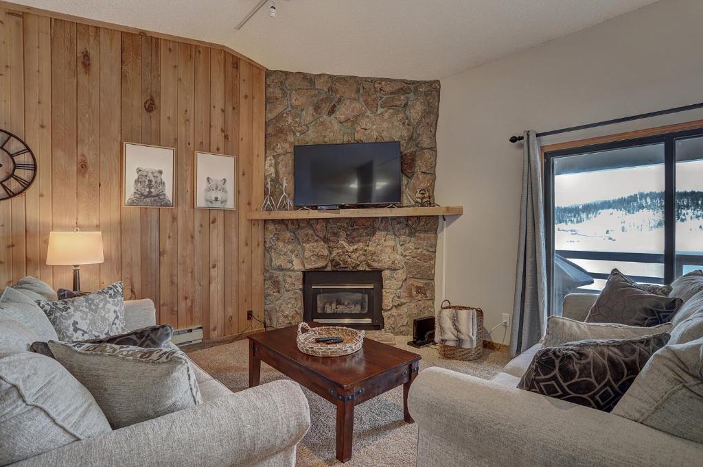 a living room with two couches and a fireplace at 303D Dillon Bay Condo Condo in Dillon