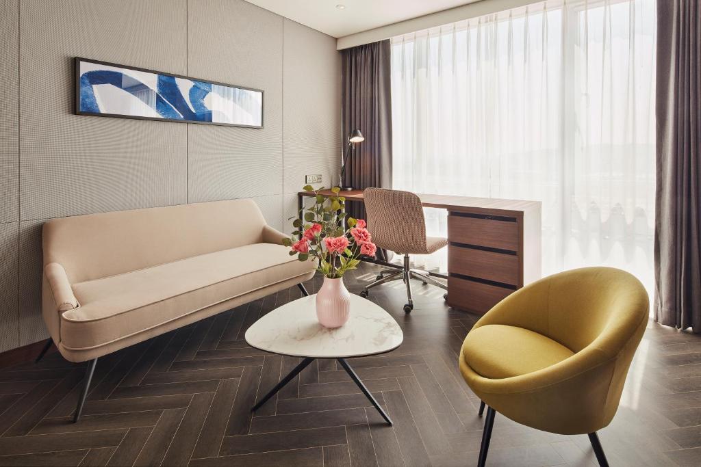TV a/nebo společenská místnost v ubytování Ramada Encore by Wyndham Gimpo Han River Hotel