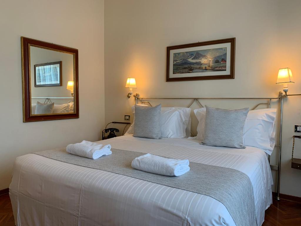 Postel nebo postele na pokoji v ubytování Hotel David