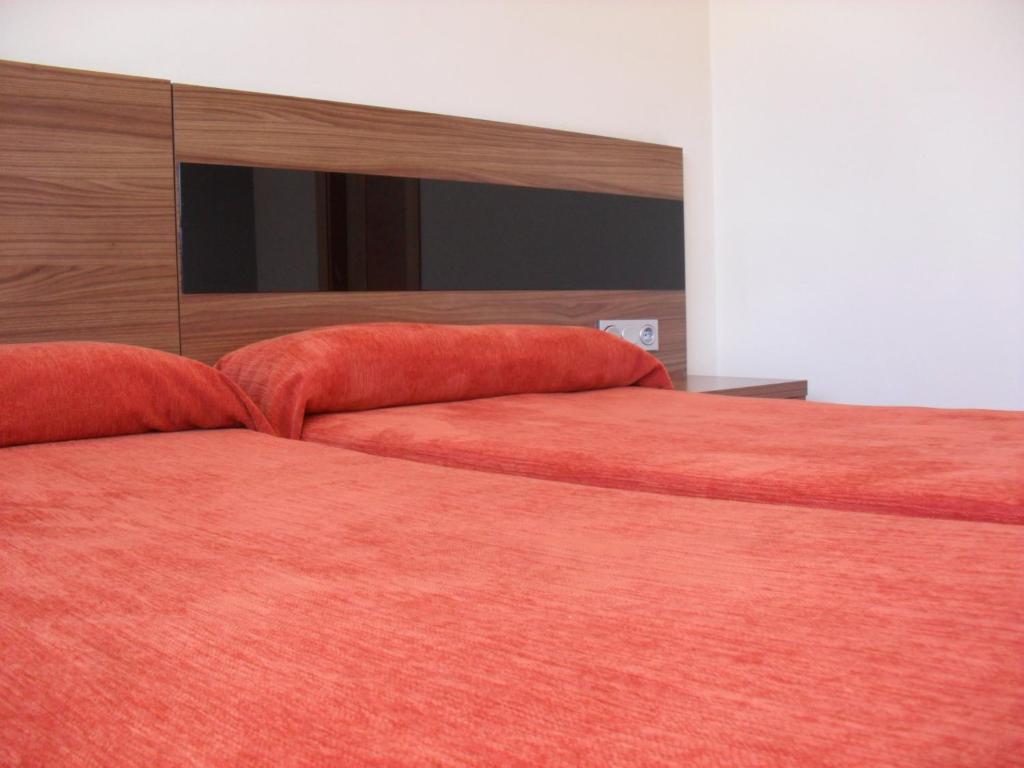 Postel nebo postele na pokoji v ubytování Hotel El Cruce Moraleda