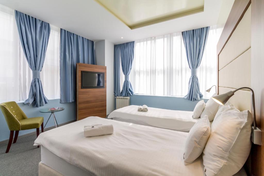 Postel nebo postele na pokoji v ubytování Privilege Suites by Central Park