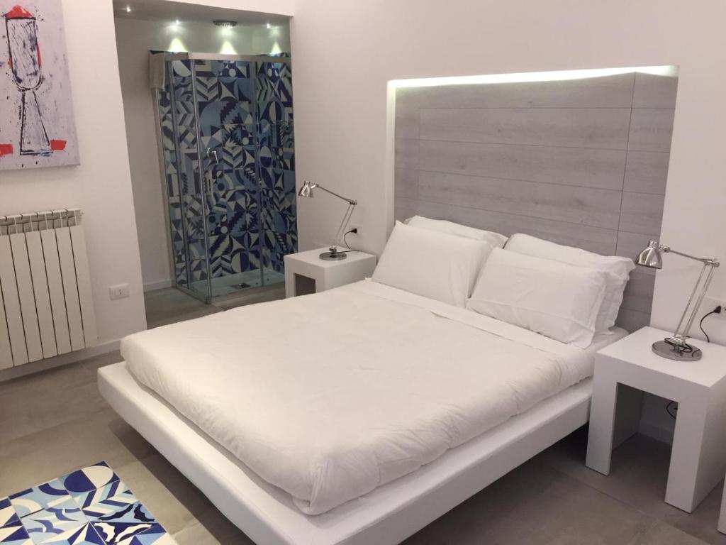 Säng eller sängar i ett rum på B&B Costa di Amalfi