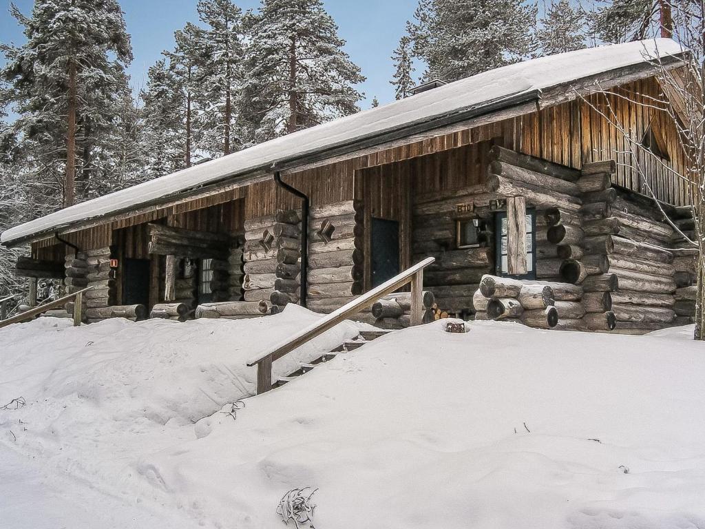 a log cabin in the snow with snow at Holiday Home Vuokatinportti b 9 by Interhome in Lahdenperä
