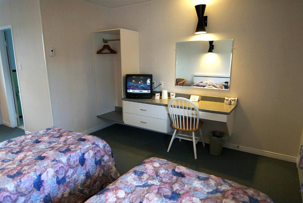 Kuchyň nebo kuchyňský kout v ubytování Daigle's Motel