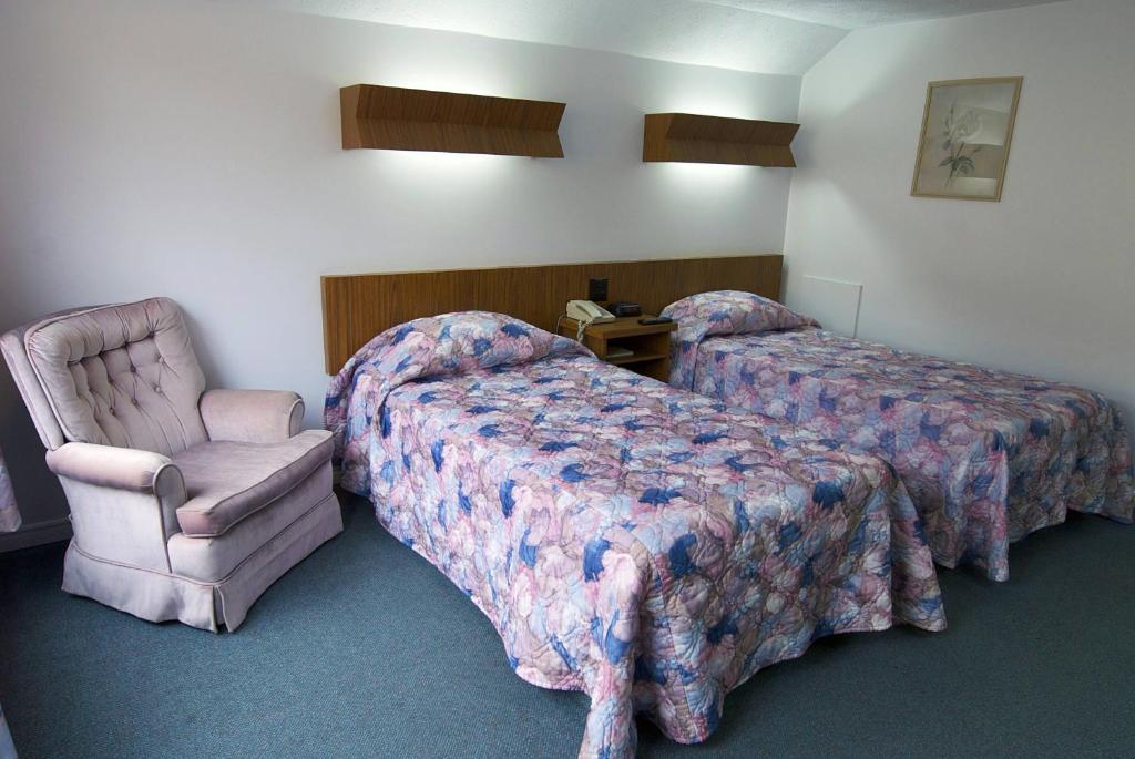Postel nebo postele na pokoji v ubytování Daigle's Motel